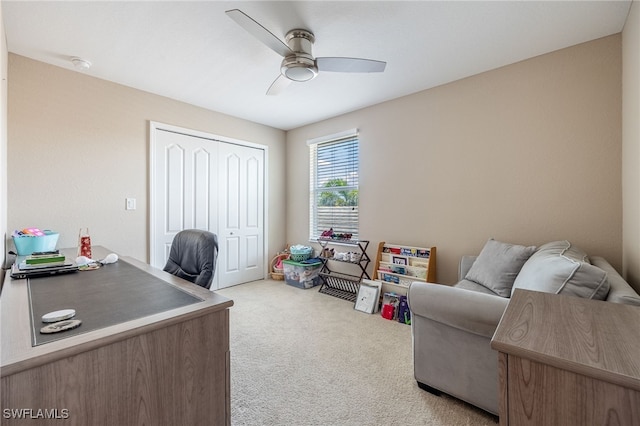 office with carpet flooring and a ceiling fan