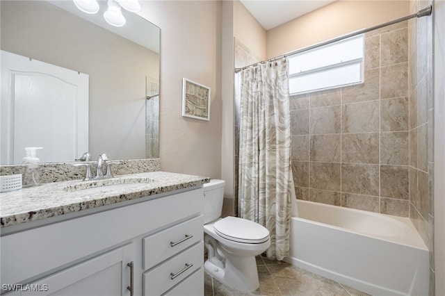 bathroom featuring toilet, shower / tub combo with curtain, tile patterned floors, and vanity