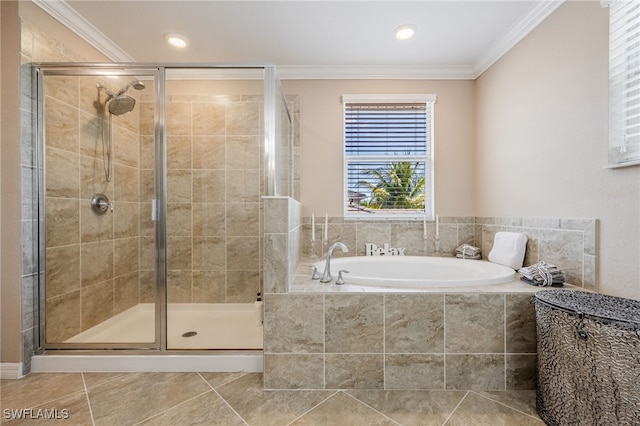bathroom featuring a shower stall, ornamental molding, a garden tub, and tile patterned floors