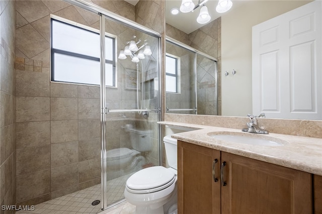 3412 Atlantic Cir, Naples, FL 34119 - full bath with vanity, a wealth of natural light, toilet, and a shower stall