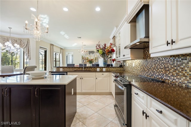 3412 Atlantic Cir, Naples, FL 34119 - kitchen with an inviting chandelier, wall chimney range hood, a sink, and stainless steel electric stove