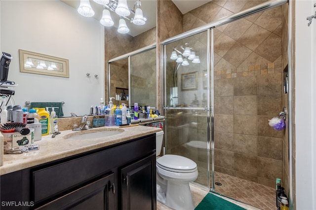 3412 Atlantic Cir, Naples, FL 34119 - full bathroom featuring vanity, a stall shower, and toilet