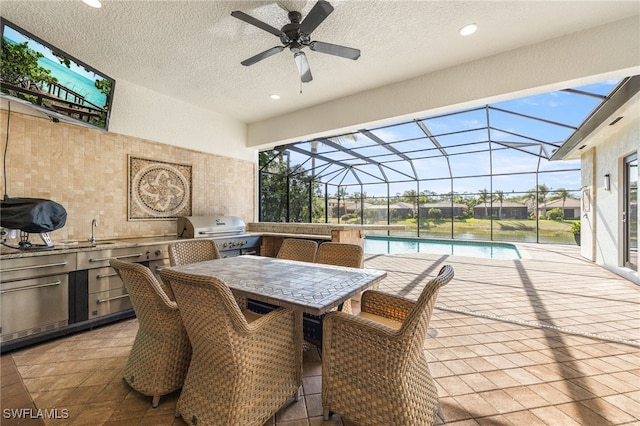 3412 Atlantic Cir, Naples, FL 34119 - view of patio / terrace with an outdoor kitchen, an outdoor pool, a ceiling fan, a lanai, and a grill