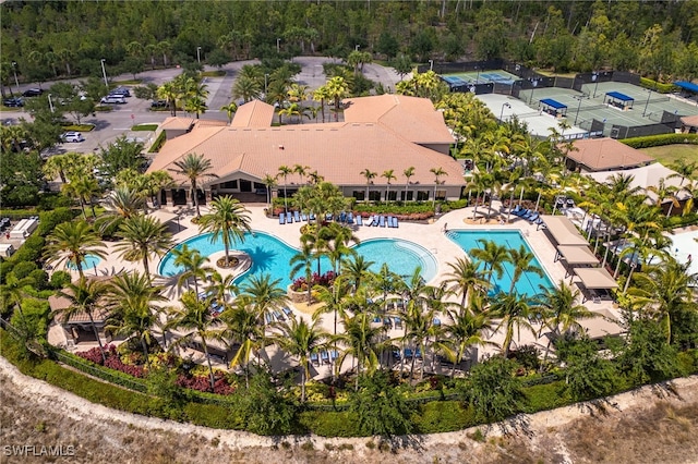 3412 Atlantic Cir, Naples, FL 34119 - bird's eye view featuring a wooded view