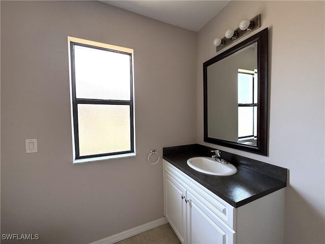 bathroom with baseboards and vanity