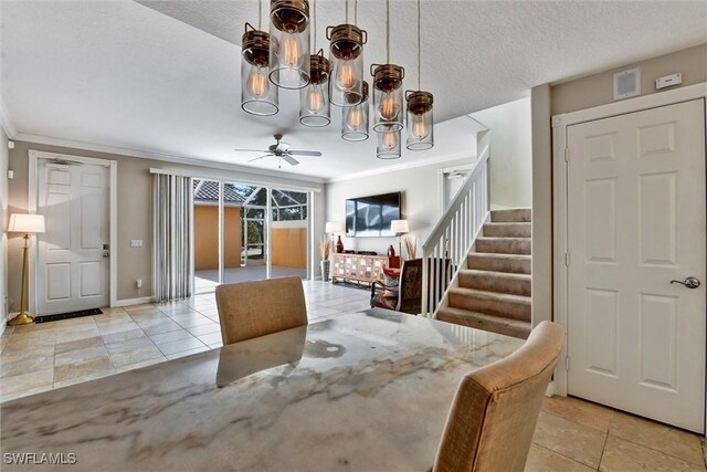 dining space with crown molding, stairway, visible vents, and tile patterned flooring