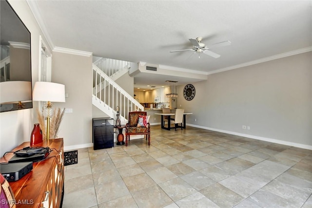 interior space with ceiling fan, visible vents, ornamental molding, and stairway