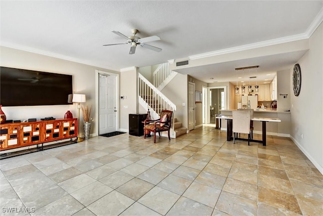 living area featuring ceiling fan, visible vents, stairway, baseboards, and ornamental molding