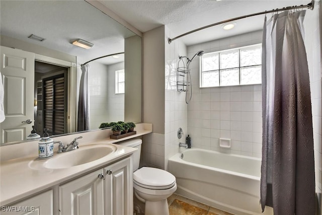 bathroom with visible vents, shower / tub combo with curtain, a healthy amount of sunlight, and toilet