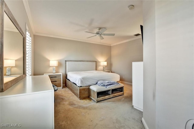 bedroom with crown molding, baseboards, light colored carpet, and visible vents