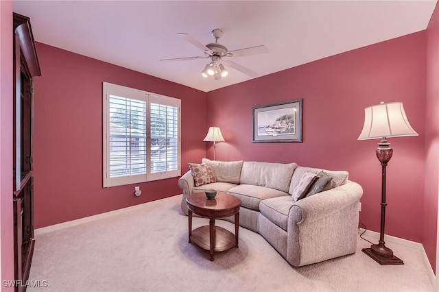 3775 Fieldstone Blvd Unit 104, Naples, FL 34109 - carpeted living area with baseboards and ceiling fan