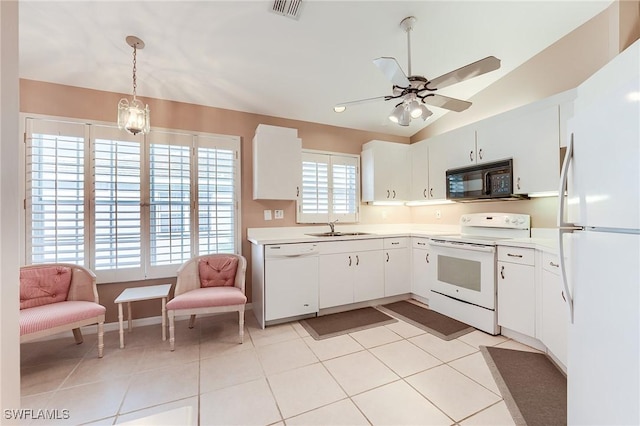 3775 Fieldstone Blvd Unit 104, Naples, FL 34109 - kitchen featuring visible vents, a ceiling fan, white appliances, light countertops, and a sink