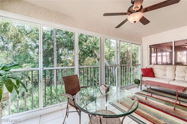 3775 Fieldstone Blvd Unit 104, Naples, FL 34109 - sunroom / solarium with tile patterned floors, ceiling fan, and outdoor dining area