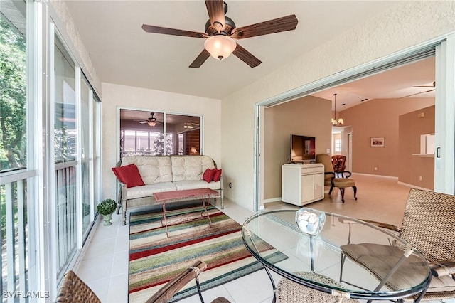 3775 Fieldstone Blvd Unit 104, Naples, FL 34109 - living area with a ceiling fan and tile patterned flooring