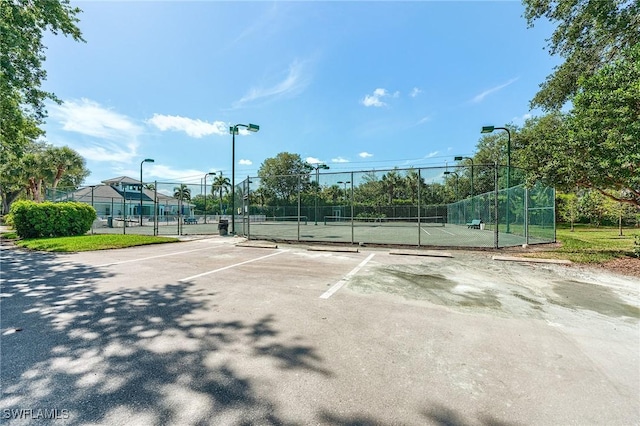 3775 Fieldstone Blvd Unit 104, Naples, FL 34109 - view of tennis court with fence