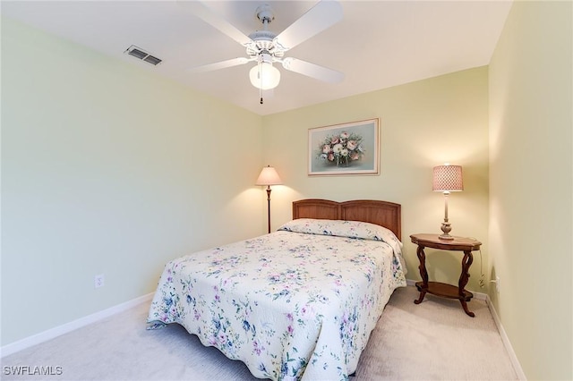 3775 Fieldstone Blvd Unit 104, Naples, FL 34109 - bedroom with a ceiling fan, baseboards, visible vents, and light carpet