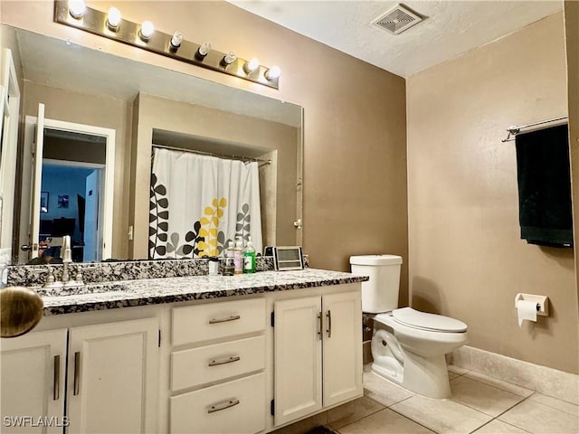 full bathroom with tile patterned floors, vanity, toilet, and visible vents
