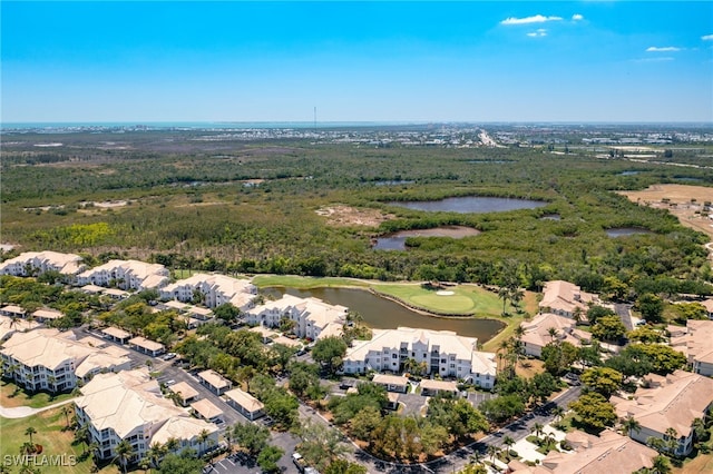 birds eye view of property featuring a water view and golf course view