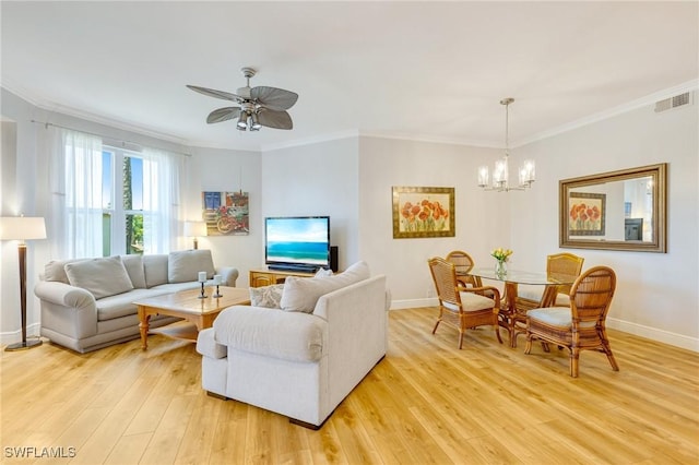 living area featuring visible vents, light wood-style flooring, and baseboards