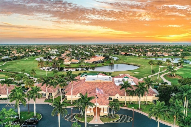 aerial view featuring a residential view, a water view, and golf course view