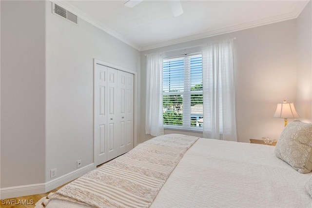 16400 Millstone Cir Unit 206, Fort Myers, FL 33908 - bedroom featuring crown molding, baseboards, a closet, a ceiling fan, and wood finished floors