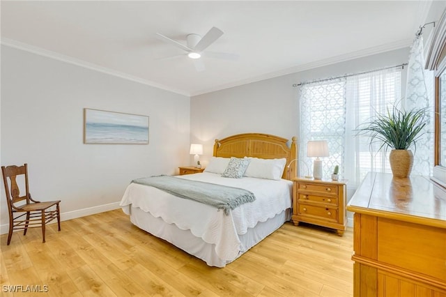 bedroom with baseboards, ornamental molding, a ceiling fan, and light wood-type flooring
