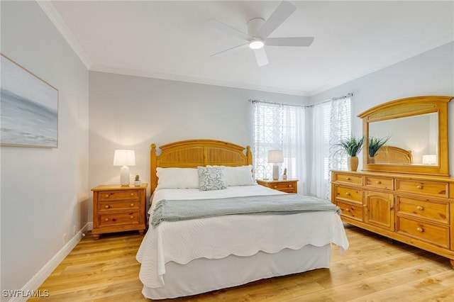 bedroom featuring light wood-type flooring, ornamental molding, baseboards, and a ceiling fan