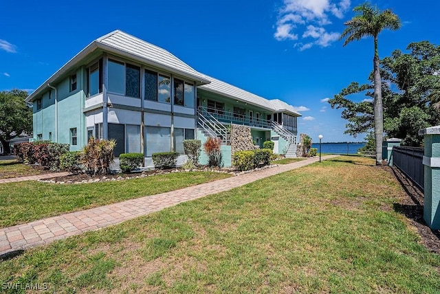 3225 E Riverside Dr Unit 26B, Fort Myers, FL 33916 - back of house featuring stairway and stucco siding