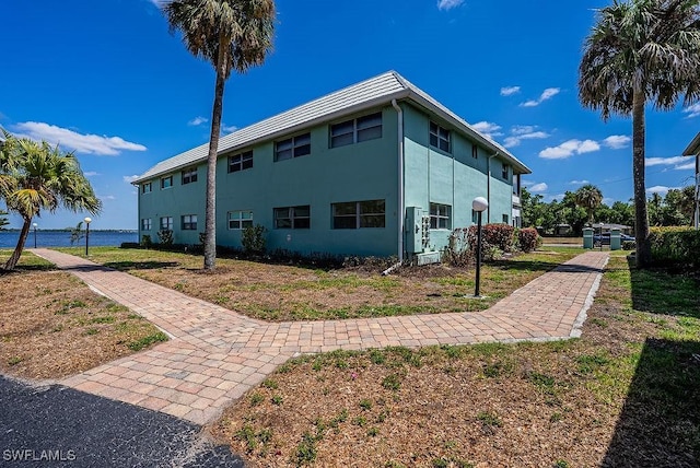 3225 E Riverside Dr Unit 26B, Fort Myers, FL 33916 - view of side of property featuring stucco siding