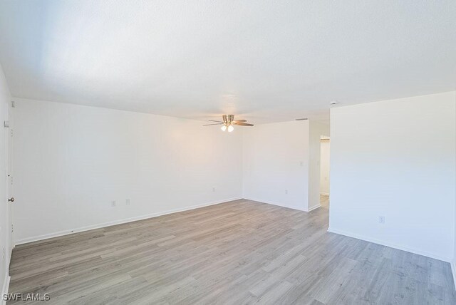 3225 E Riverside Dr Unit 26B, Fort Myers, FL 33916 - empty room with ceiling fan, light wood-type flooring, and baseboards