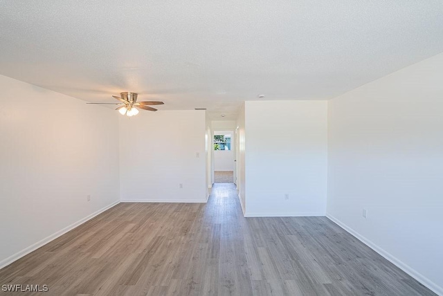 3225 E Riverside Dr Unit 26B, Fort Myers, FL 33916 - spare room with ceiling fan, wood finished floors, and baseboards