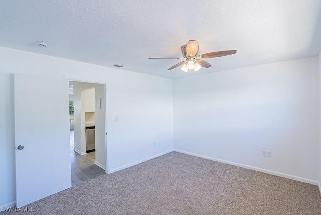 3225 E Riverside Dr Unit 26B, Fort Myers, FL 33916 - empty room featuring carpet flooring, a ceiling fan, baseboards, a textured ceiling, and a smoke detector