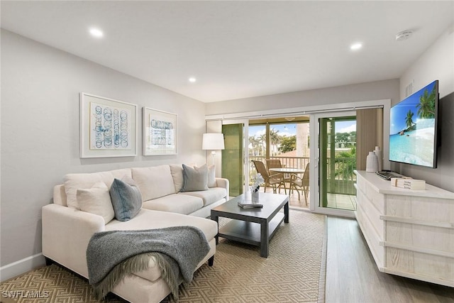 261 S Collier Blvd Unit 304, Marco Island, FL 34145 - living room featuring recessed lighting and wood finished floors