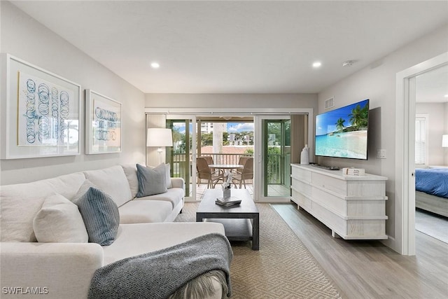 261 S Collier Blvd Unit 304, Marco Island, FL 34145 - living area with recessed lighting, a healthy amount of sunlight, and wood finished floors