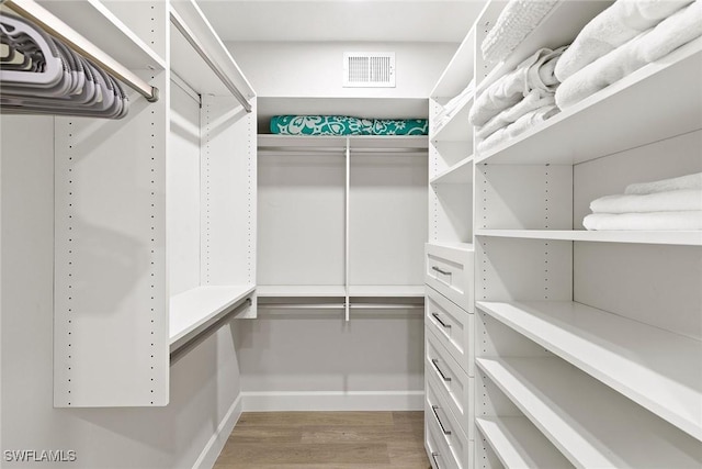 261 S Collier Blvd Unit 304, Marco Island, FL 34145 - walk in closet featuring light wood-style floors and visible vents