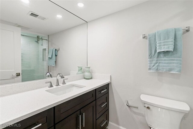 261 S Collier Blvd Unit 304, Marco Island, FL 34145 - bathroom featuring visible vents, vanity, a shower, toilet, and recessed lighting