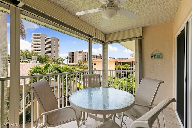 261 S Collier Blvd Unit 304, Marco Island, FL 34145 - balcony with a ceiling fan