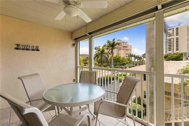 261 S Collier Blvd Unit 304, Marco Island, FL 34145 - balcony featuring ceiling fan