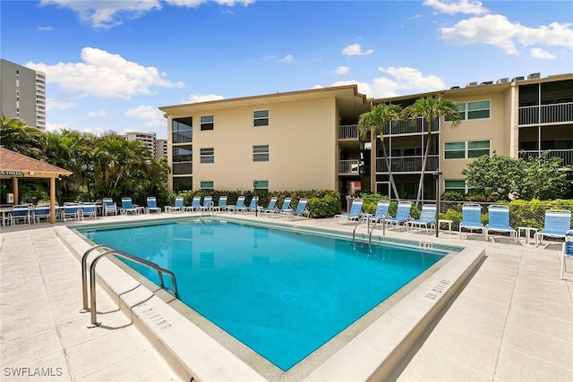 261 S Collier Blvd Unit 304, Marco Island, FL 34145 - community pool featuring a patio area