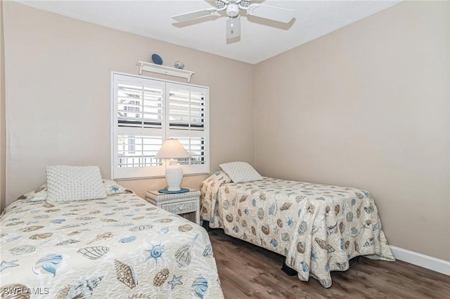 bedroom featuring baseboards, ceiling fan, and wood finished floors