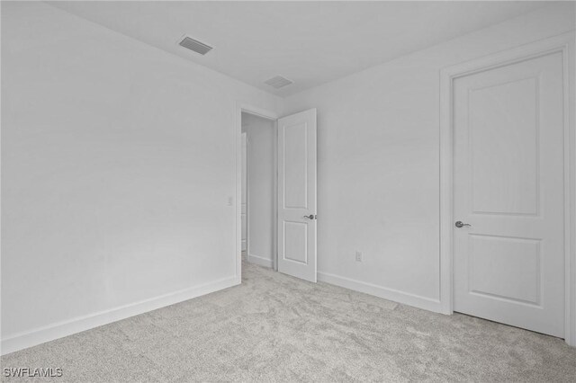 unfurnished bedroom with carpet and baseboards
