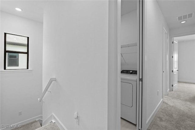 laundry area featuring washer / dryer, light carpet, baseboards, and recessed lighting