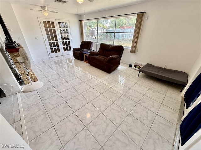 314 Vermont Way, Lehigh Acres, FL 33936 - tiled living room with ceiling fan and french doors