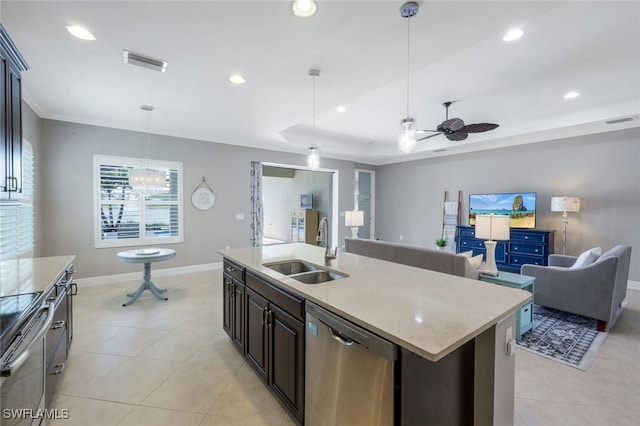 kitchen featuring dishwasher, a sink, open floor plan, a ceiling fan, and baseboards
