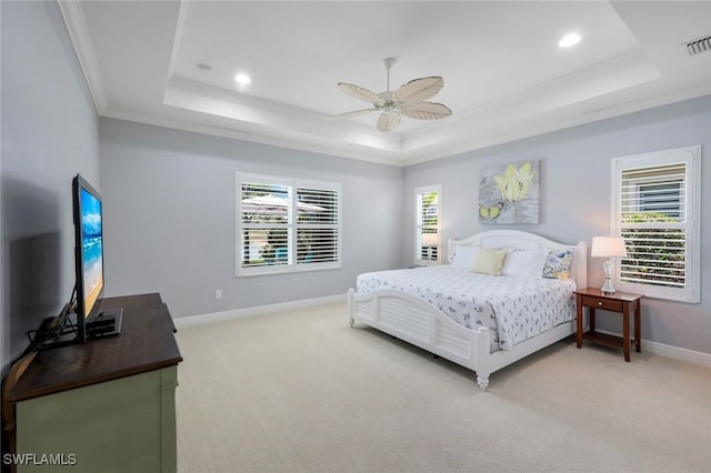 bedroom featuring a raised ceiling, light colored carpet, baseboards, ornamental molding, and recessed lighting