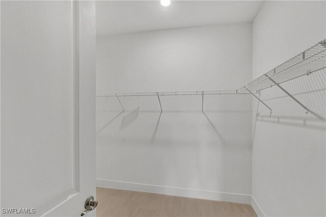 44332 Panther Dr, Punta Gorda, FL 33982 - walk in closet featuring light wood-style flooring