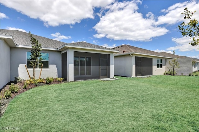 44332 Panther Dr, Punta Gorda, FL 33982 - back of property with a sunroom, stucco siding, and a yard