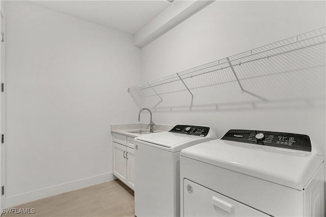 44332 Panther Dr, Punta Gorda, FL 33982 - washroom with separate washer and dryer, baseboards, and cabinet space