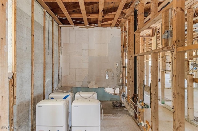 3965 W Riverside Dr, Fort Myers, FL 33901 - clothes washing area with concrete block wall and washing machine and clothes dryer