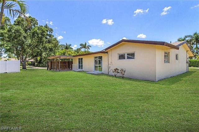 3965 W Riverside Dr, Fort Myers, FL 33901 - rear view of property with stucco siding